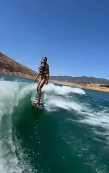 A picture of Josie Redmond surfing