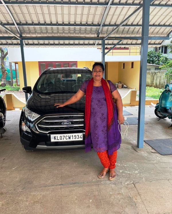 A picture of Maneesha Subramaniam taken with her car