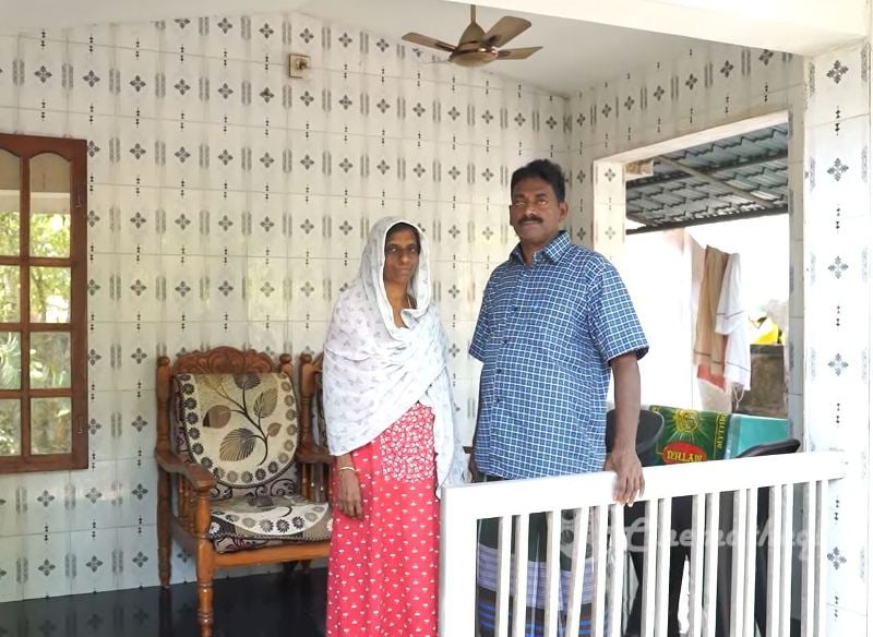 Najeeb Muhammad with his wife at home