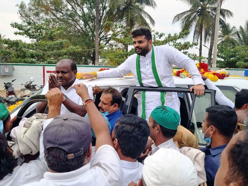 Prajwal Revanna with H. D. Kumaraswamy during a political campaign