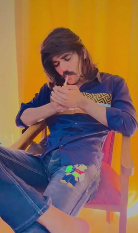 A picture of Rohit Bhati while smoking a cigarette