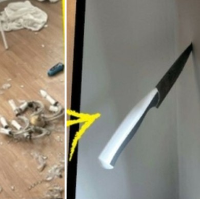 A picture of broken things and knife on a wall in a Frogner apartment