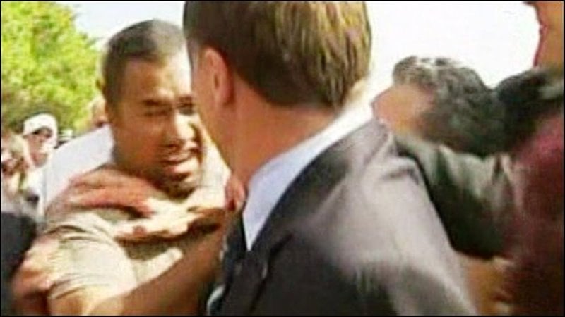 A protestor heckling John Key