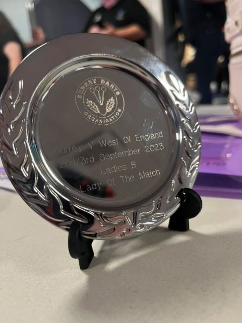A silver shield won by Eloise Milburn at a darts competition (2023)
