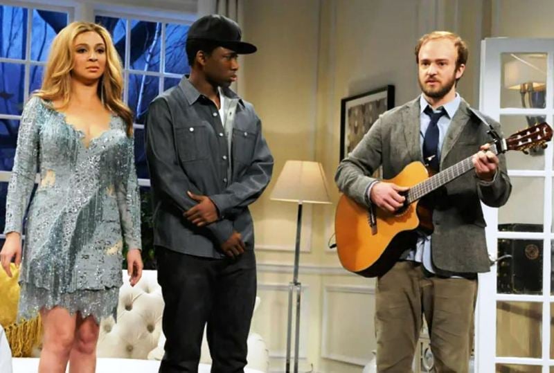 A still from the Saturday Night Live show, featuring Maya Rudolph (left, as Beyoncé), Jay Pharoah (centre, as Jay-Z), and Justin Timberlake (right, as Bon Iver)