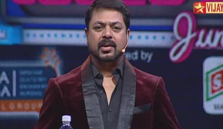 A still of James Vasanthan hosting a TV show on Star Vijay