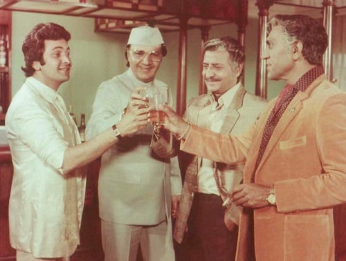 A still of Pran with Rishi Kapoor and other actors from a Hindi film