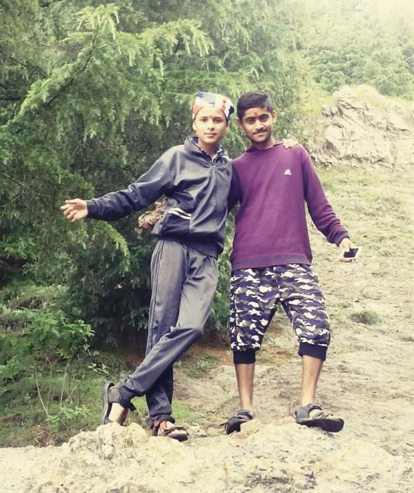 A teenage photo of Nitish Bhaluni (left)