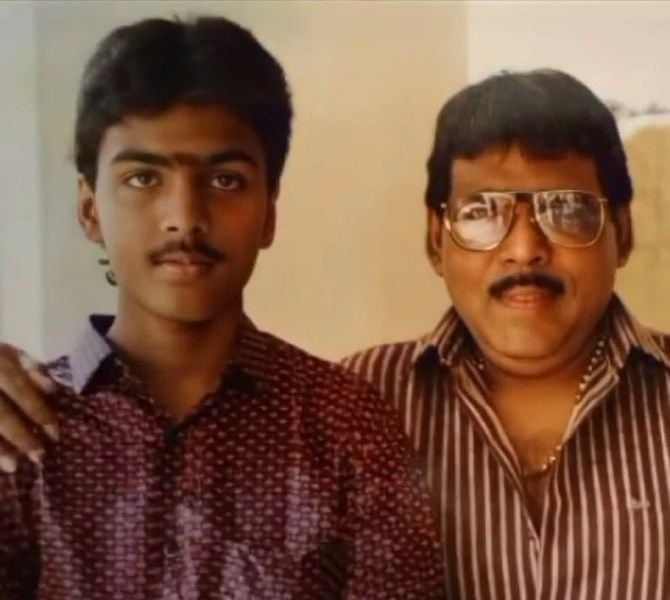 A young age photo of Yugendran with his father