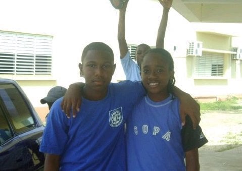 Aaron Jones (right) during his childhood when he played both soccer and cricket