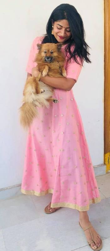 Abhignya Vuthaluru with her pet dog