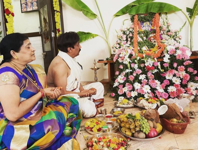 Abhijith and his wife performing a pooja