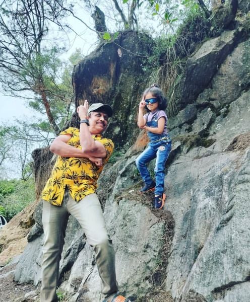 Abhijith with his granddaughter