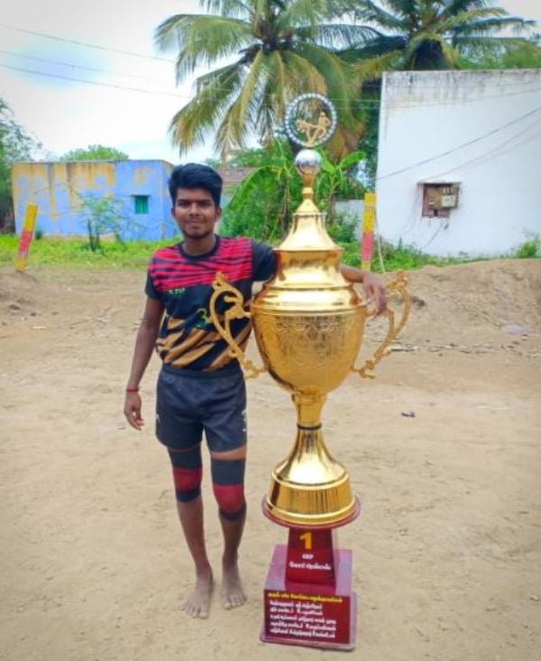 Abinand Subhash posing with the Salem Kabaddi Cup