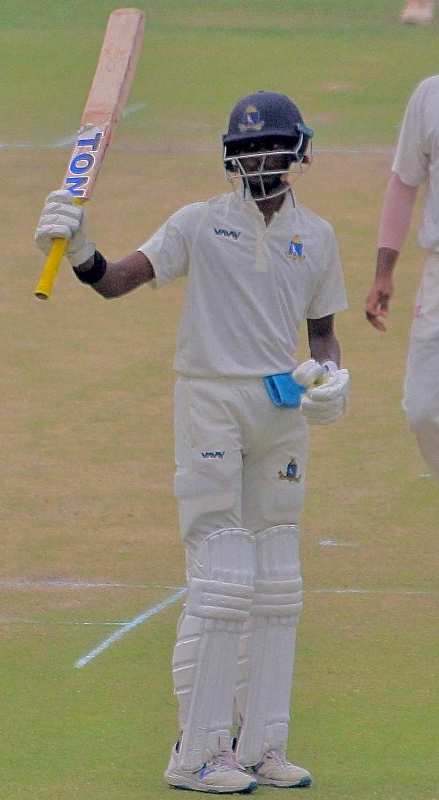 Abishek Porel celebrating his half-century on his Ranji debut