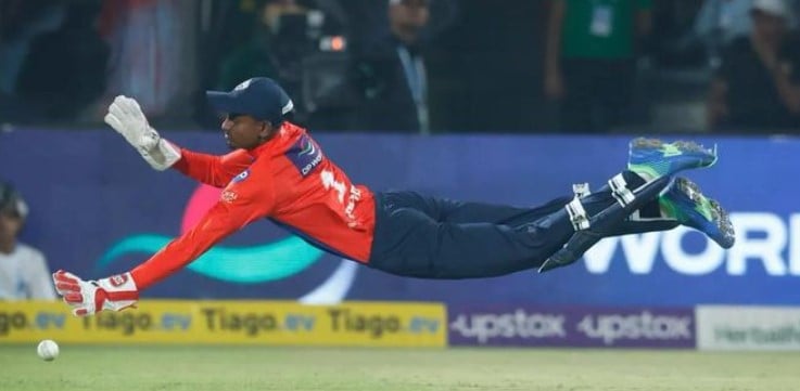 Abishek Porel diving catch to dismiss Rohit Sharma