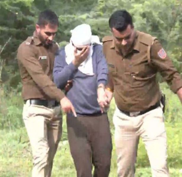 Accused Aftab Poonawala being taken to the forest area in Mehrauli near Delhi, where he allegedly disposed of pieces of Shraddha