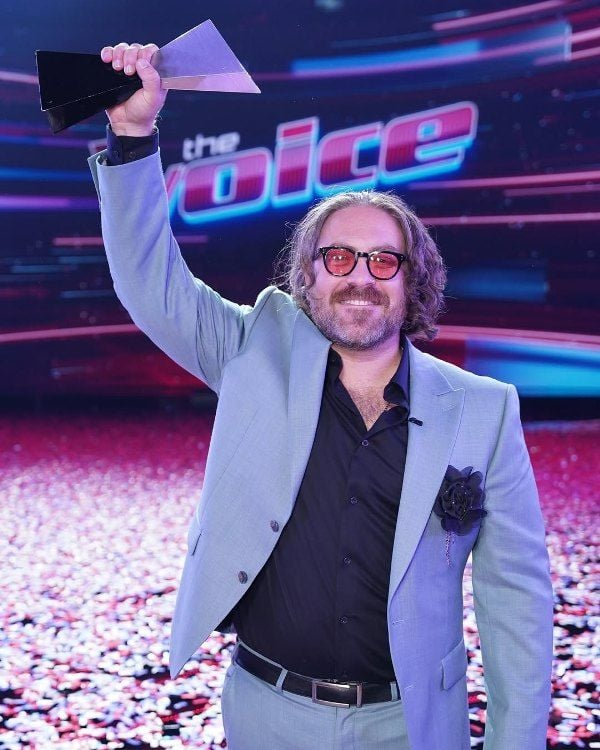 Adam David as the winner of the reality show 