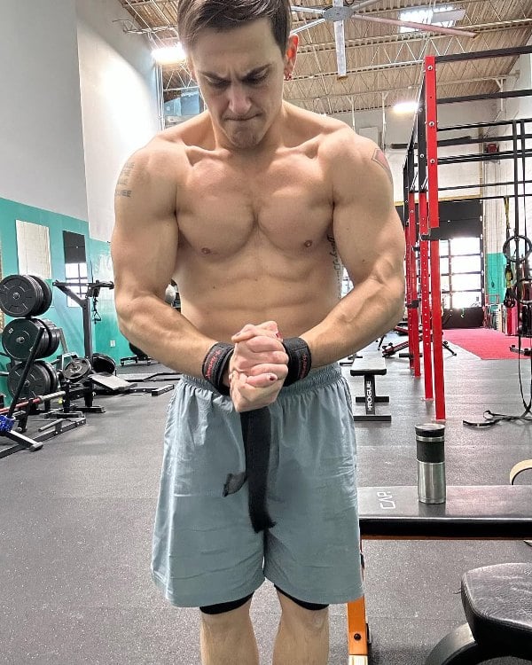 Adam Turck posing at a gym