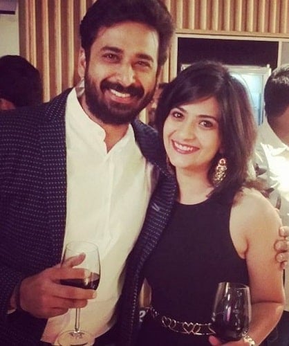 Aditi Sharma holding a glass of wine
