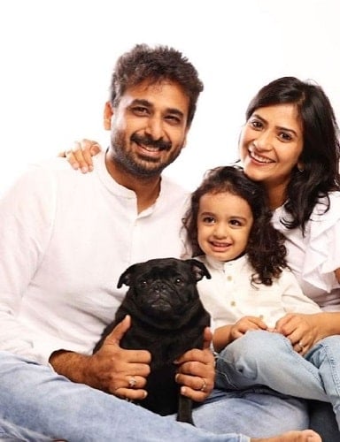 Aditi Sharma with her husband, son, and pet dog