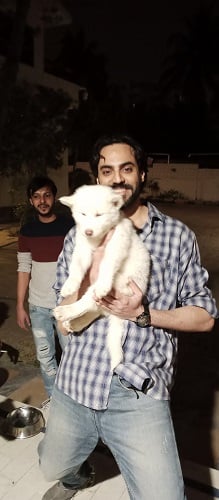 Adnan Hussain with a dog