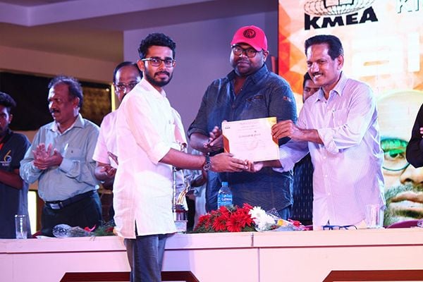 Adoney John receiving his certificate of KMEA Speech Competition