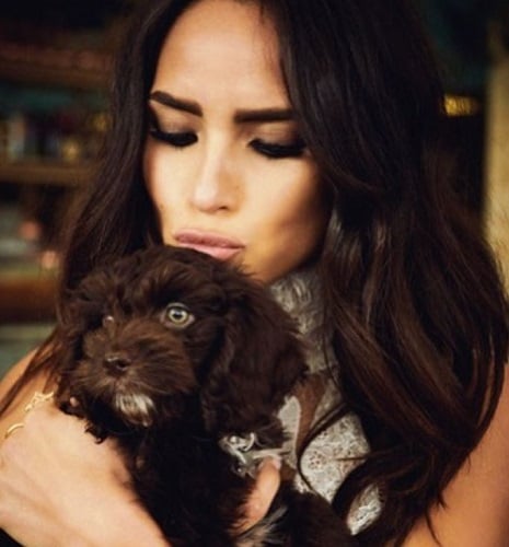 Adria Arjona with a dog
