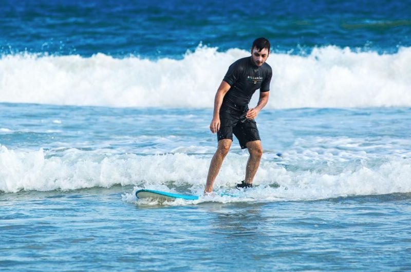 Agneya Singh water surfing on a vacation in Sri Lanka