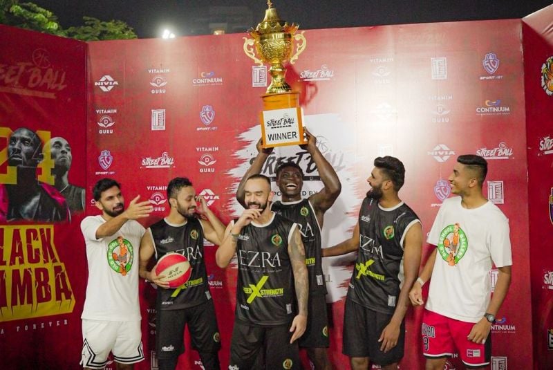 Agu Stanley posing with his team Old School Ballers after winning Street Ball League Season 4