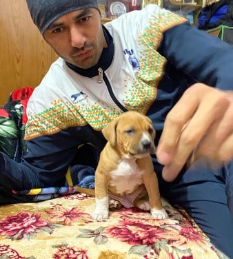 Ajay Thakur posing with his pet
