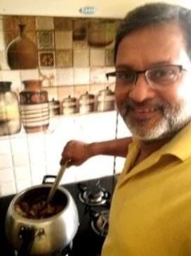 Ajit Anjum cooking at home