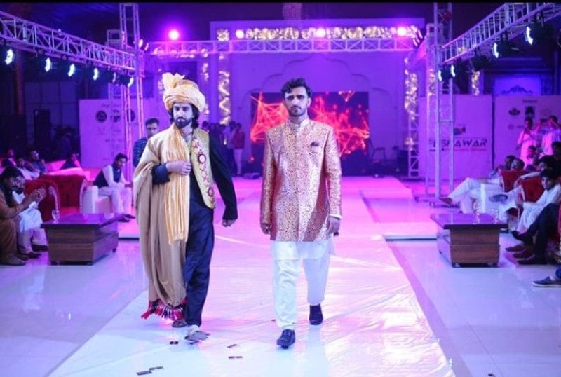 Ajmal Haqiqi during a ramp walk in a fashion show in Afghanistan