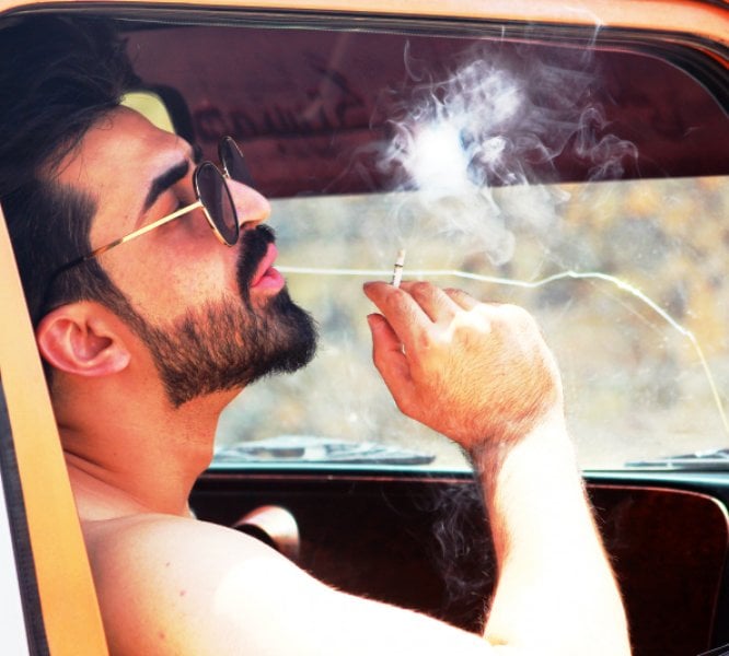Ajmal Haqiqi smoking