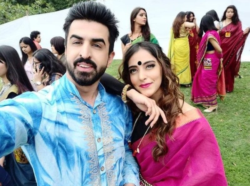 Ajmal Haqiqi with an Indian model