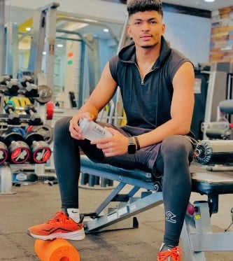 Akash Shinde posing at a gym