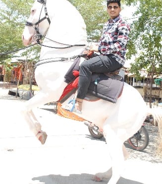 Akash Shinde while enjoying a horse ride