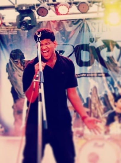 Akbar Khan while singing with a band in 2016