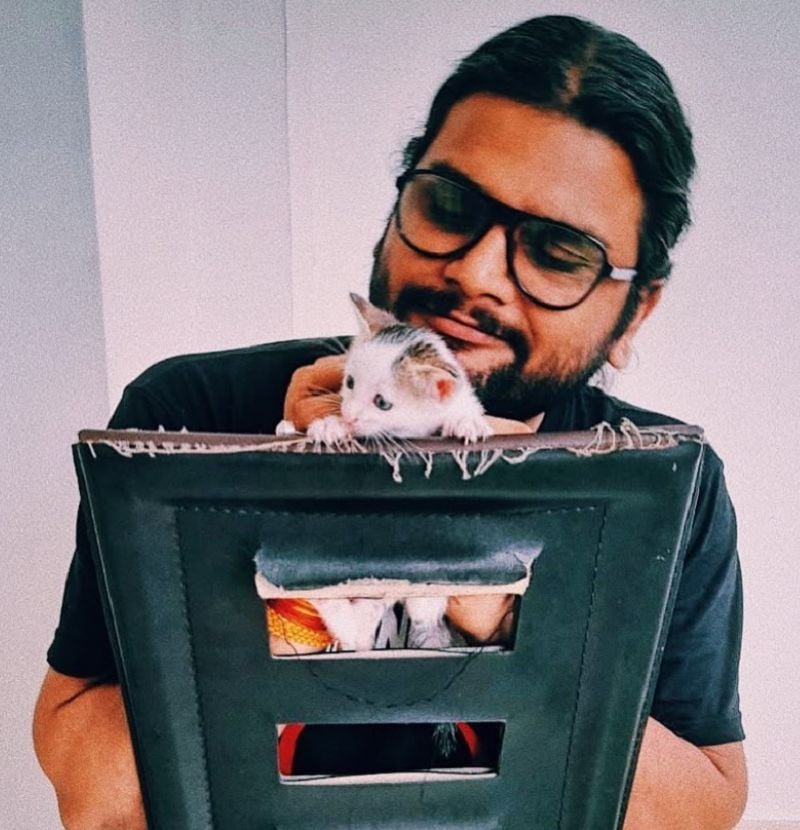 Akshat Ajay Sharma with a cat