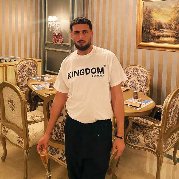 Alaudin Hamiti while having champagne