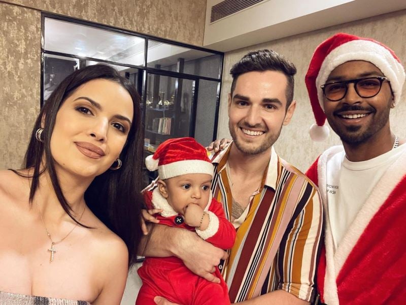 Aleksandar Alex Ilic (center) with Nataša Stanković, Hardik Pandya, and their son