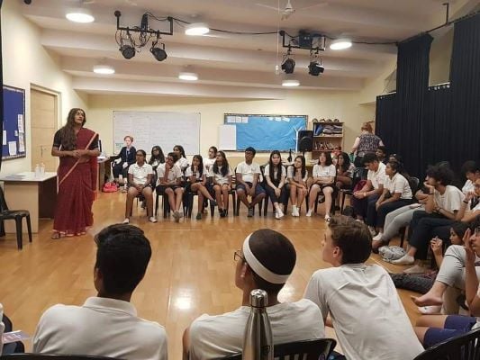 Alex Mathew (Maya the Drag Queen) teaching at a school