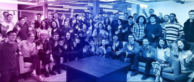 Alexandr Wang with team members at Scale AI office