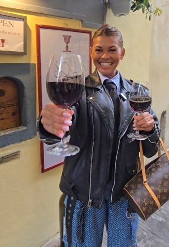 Alexandra Joner while enjoying a glass of wine