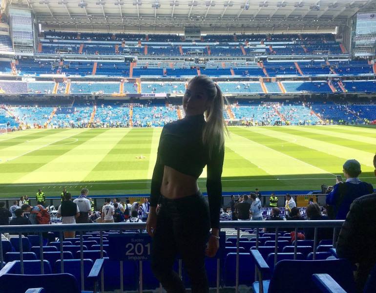 Alexandra Mendez posing at a football stadium