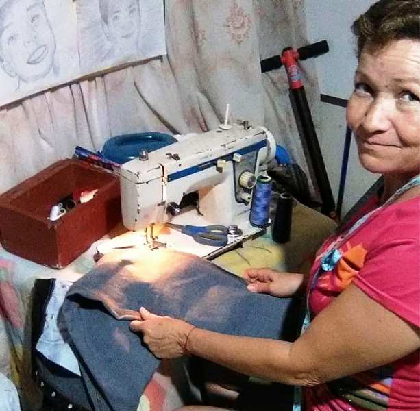 Aleyda Gaviria while sewing clothes