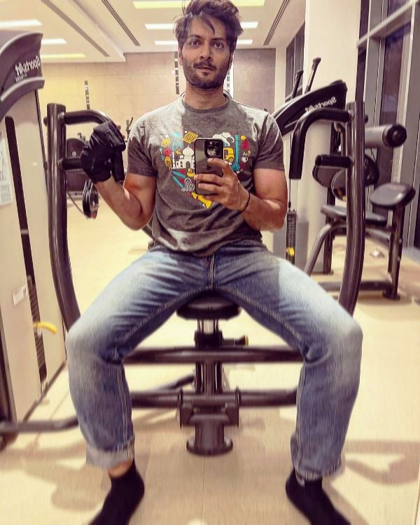 Ali Fazal while working out at a gym