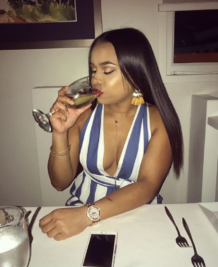 Alyssa Miguel with a glass of wine