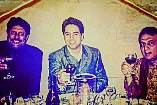 Aman Verma holding a glass of wine