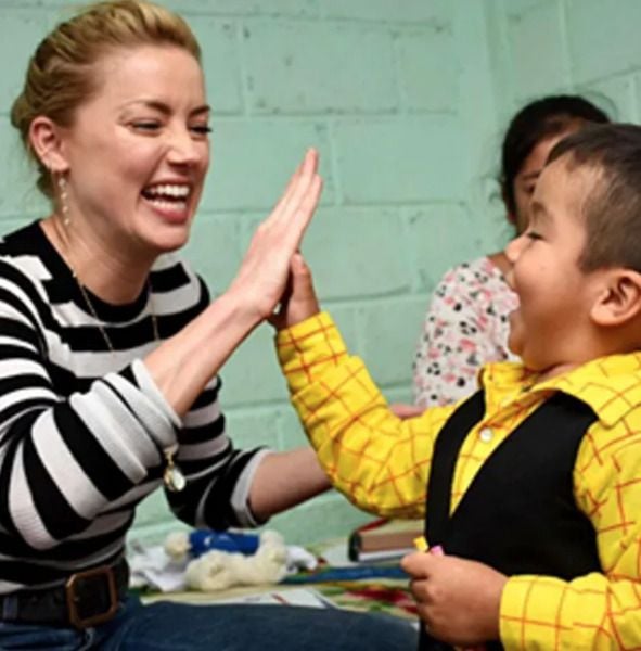 Amber Heard at a refugee camp